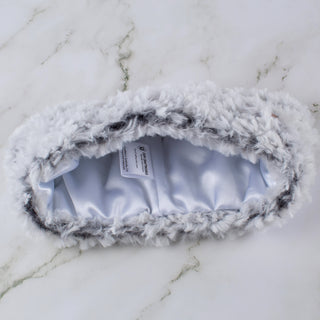 Faux fur satin lined winter headband in white and black.
