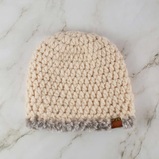 Cream satin lined winter hat with a gray faux fur trim.