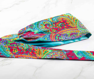 Satin lined headband in turquoise, maroon, green, and orange.