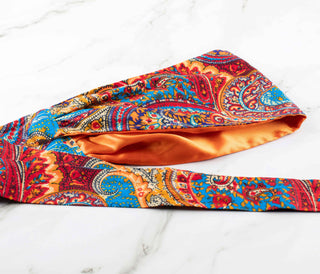 Satin lined headband in orange, blue, and red.
